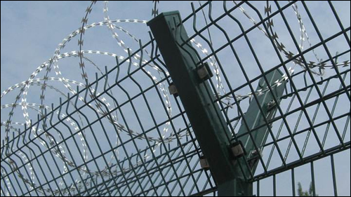 Y arm steel post supported concertina coils fencing